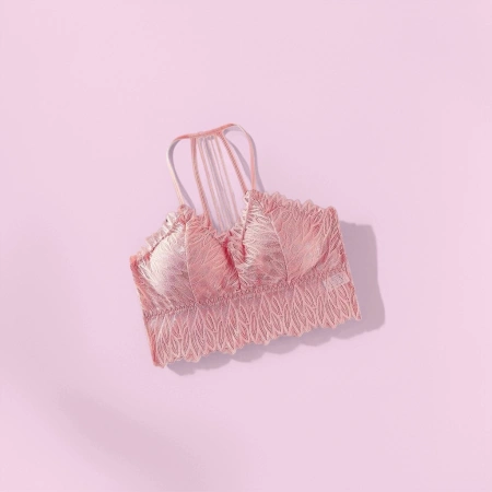 The pink lace bra, a comfortable undergarment without underwire, makes a woman's small chest look larger, sexy and breathable The pink lace bra, a comfortable undergarment without underwire, makes a woman's small chest look larger, sexy and breathable